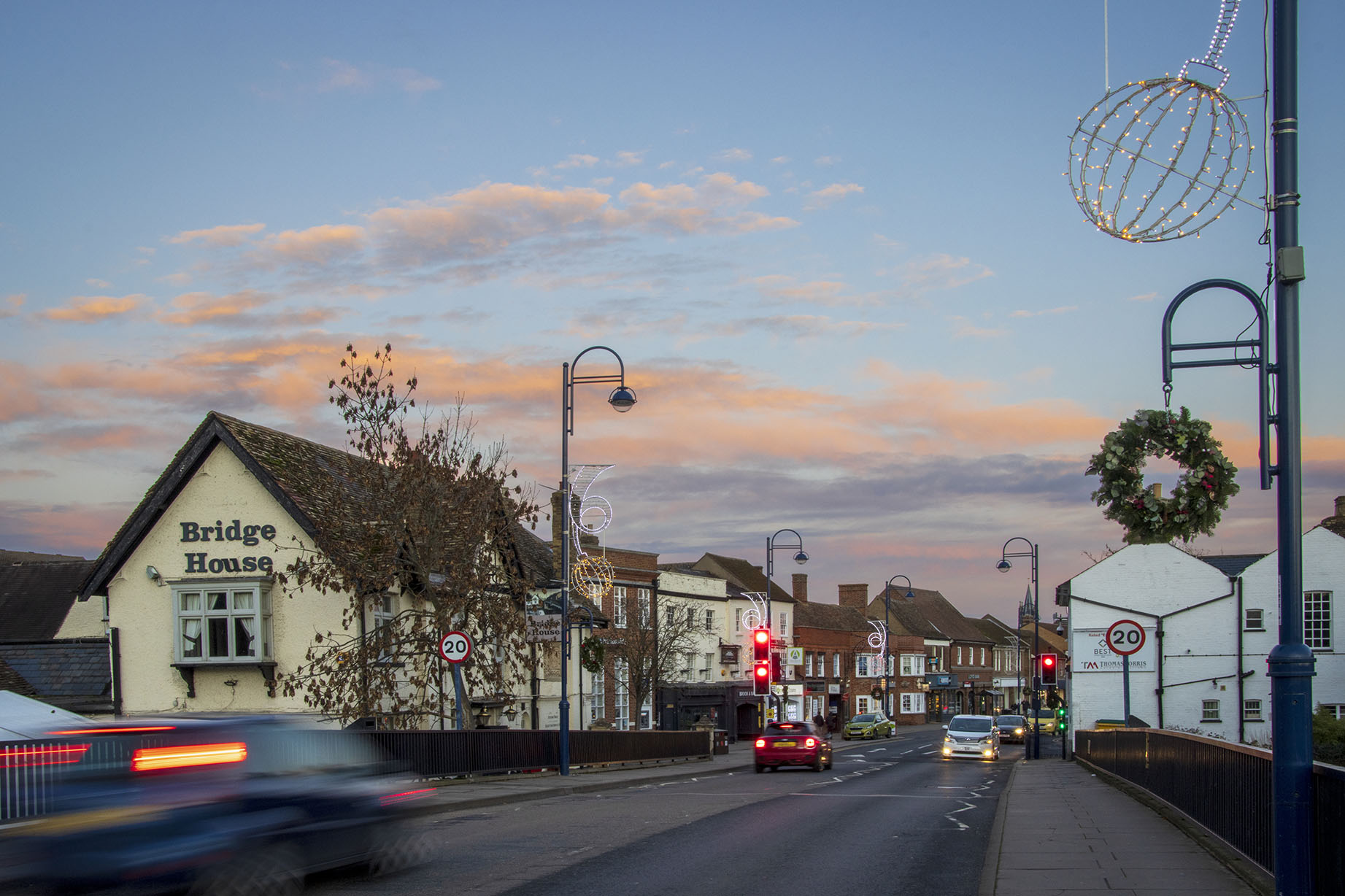 St Neots town bridge with the bridge hotel and a beautiful sunset sky. High quality photo